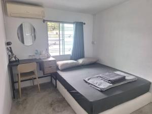 Ένα ή περισσότερα κρεβάτια σε δωμάτιο στο Phangan backpacker