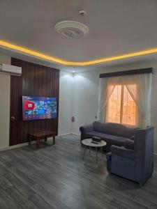 Et tv og/eller underholdning på ليالي أكنان للشقق المخدومة فرع2 + 19 billeder