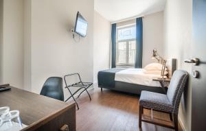 Postel nebo postele na pokoji v ubytování Résidence-Hotel Le Quinze Grand Place Brussels