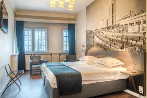 Postel nebo postele na pokoji v ubytování Résidence-Hotel Le Quinze Grand Place Brussels