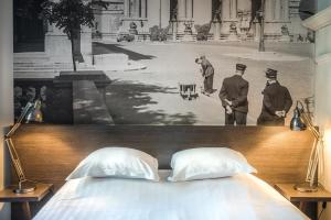 Postel nebo postele na pokoji v ubytování Résidence-Hotel Le Quinze Grand Place Brussels
