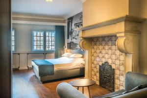 Postel nebo postele na pokoji v ubytování Résidence-Hotel Le Quinze Grand Place Brussels