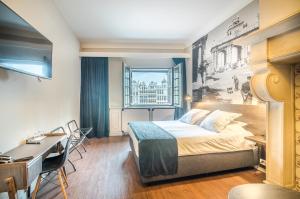 Postel nebo postele na pokoji v ubytování Résidence-Hotel Le Quinze Grand Place Brussels