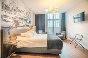 Postel nebo postele na pokoji v ubytování Résidence-Hotel Le Quinze Grand Place Brussels