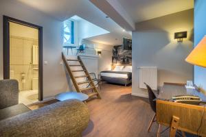 Postel nebo postele na pokoji v ubytování Résidence-Hotel Le Quinze Grand Place Brussels