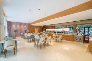Restaurace v ubytování Magnotel Business Xuzhou Jinying Sudi Road Metro Station