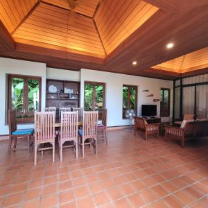 a dining room with a table and chairs at The Great Escape Pool Seaview Villa in Ko Lanta