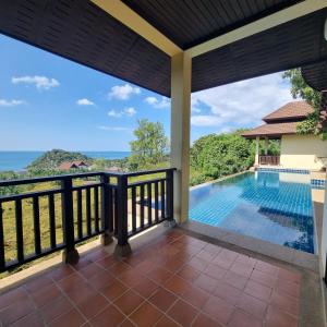 a view from the balcony of a villa with a swimming pool at The Great Escape Pool Seaview Villa in Ko Lanta