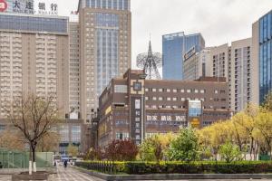 a city skyline with tall buildings in a city at Yitel Collection Shenyang North Railway Station Metro Station in Shenyang