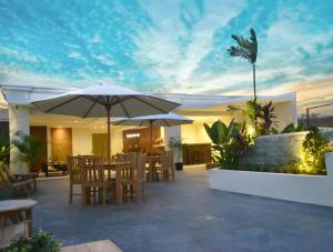A patio or other outdoor area at Amalfi Hotel Seminyak