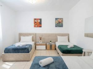 Voodi või voodid majutusasutuse Center Tirana Rooms toas +7 fotot