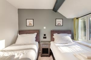 En eller flere senge i et værelse på Lanreath Cottage 3 bedroom with Hot Tub