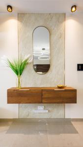 a vanity with a mirror on a wall at Stylish 2BR Retreat, Central Location, Few Steps from the Sea by QuickTrips in Marsaskala