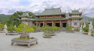 a large building with trees in front of it at Bong Mai Motel in Da Nang