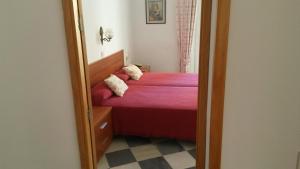 Posteľ alebo postele v izbe v ubytovaní Hostal Centro Sol