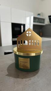 a small toy house in a container on a counter at Apartmán 135 in Trutnov