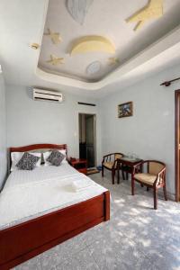 En eller flere senge i et værelse på Mỹ Tân Hotel HCM