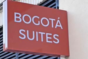 a sign for a boocosa suites on the side of a building at NUEVO -Bogotá Suites- Apartamentos con cocina, AC, 15min del centro a pie in Alicante