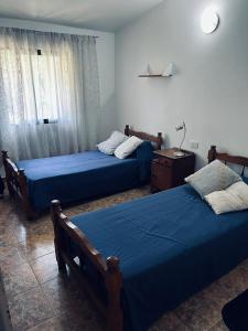 Postel nebo postele na pokoji v ubytování Hospedaje Davolio