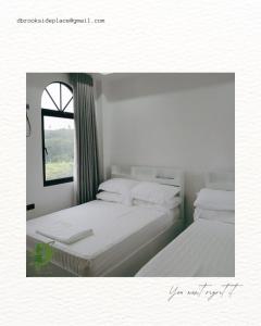 Postel nebo postele na pokoji v ubytování D'Brook Side Place