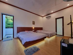 Postel nebo postele na pokoji v ubytování BeanHomestay
