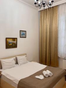 เตียงในห้องที่ Carpe Diem Boutique