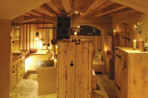 a kitchen with a refrigerator and candles in it at Turm zu Schloss Schedling in Trostberg an der Alz +104 photos