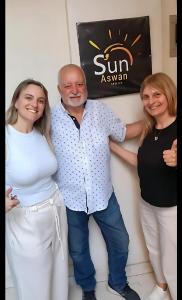 a man and two women posing for a picture at Sun Aswan inn in Aswan