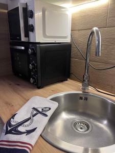 Køkken eller tekøkken på Halászfalu Apartman Green Park