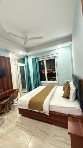 a bedroom with a large bed and a piano at D S valley in Rishīkesh