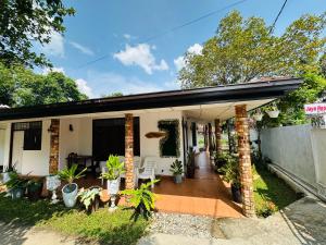 a home with a porch with potted plants at Jaya Residence - Near Airport in Negombo