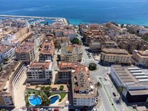 an aerial view of a city with buildings and the ocean at Calamora I by Sun & Sea Homes in Moraira
