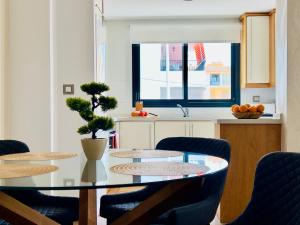 a dining room with a glass table and chairs at Calamora I by Sun & Sea Homes in Moraira