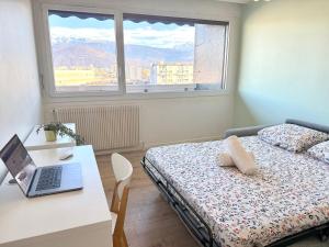 En eller flere senge i et værelse på Le Belvédère - Vue Montagne & Garage