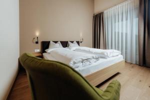 Postel nebo postele na pokoji v ubytování New Hotel Murrer