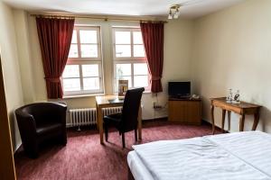 TV a/nebo společenská místnost v ubytování Burg Warberg