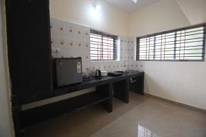 Kuchyň nebo kuchyňský kout v ubytování Arunodaya The Dream Den + 6 fotografií