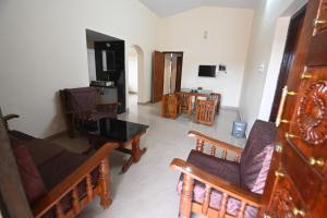 TV a/nebo společenská místnost v ubytování Arunodaya The Dream Den