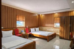 Ένα ή περισσότερα κρεβάτια σε δωμάτιο στο Quỳnh Vy Hotel Thái Nguyên