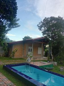 een zwembad voor een huis bij Galle Light Villa in Galle