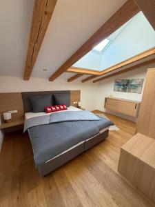 a bedroom with a bed and a skylight at Panorama Quartier Seefeld in Seefeld in Tirol