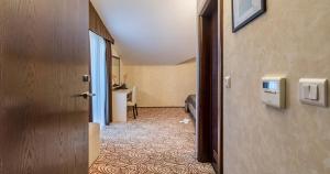 an open door to a room with a desk at Hotel Terra Nova in Novalja