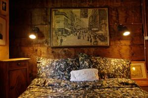 a bedroom with a bed and a picture on the wall at Lieu Secret dans les Alpes Suisses in Le Trétien +35 photos