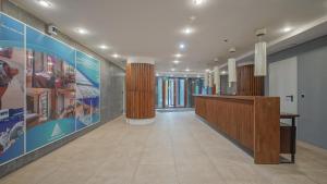 an office lobby with a reception desk and posters at Chambres Mountain in Poiana Brasov