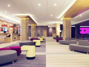 a lobby with couches and tables and chairs at Mercure Gdynia Centrum in Gdynia +84 photos