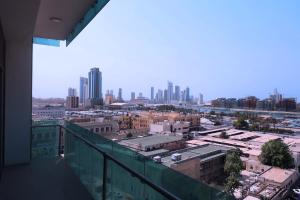 a view of a city from the balcony of a building at City Point Hotel in Manama