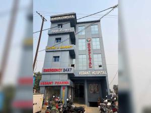 a building with motorcycles parked in front of it at Hotel O Downtown Rooms & Banquet in Darbhanga