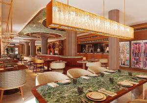 a restaurant with a table and chairs and a chandelier at Palacio San Juan, a Royal Hideaway Hotel in Murcia
