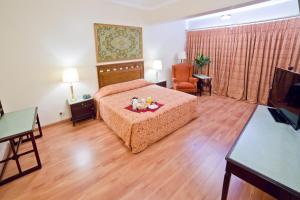 Dayrell Hotel e Centro de Convenções客房内的一张或多张床位