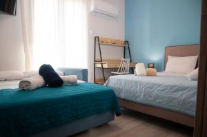 Llit o llits en una habitació de ΛΙΜΑΝΙ